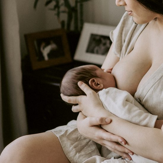 Mum breastfeeds newborn baby