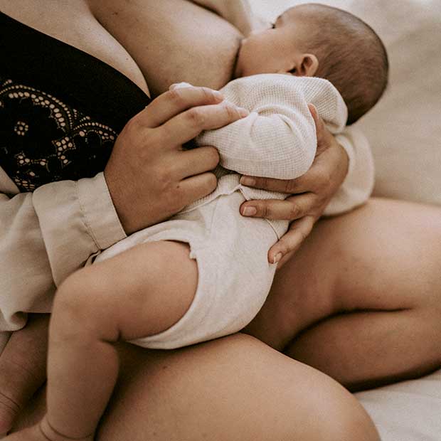 Mum breastfeeding newborn baby