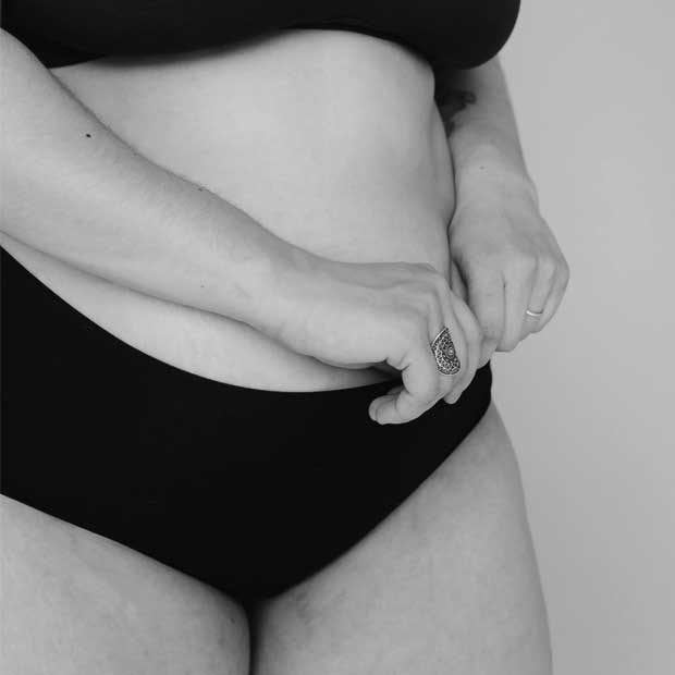 Postpartum woman in underwear