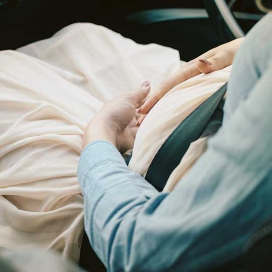 Pregnant woman travelling in car safely