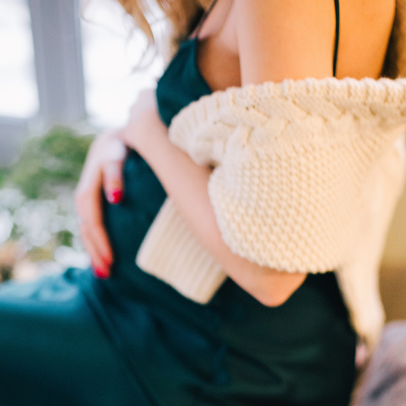 Photo of pregnant woman resting hands on belly