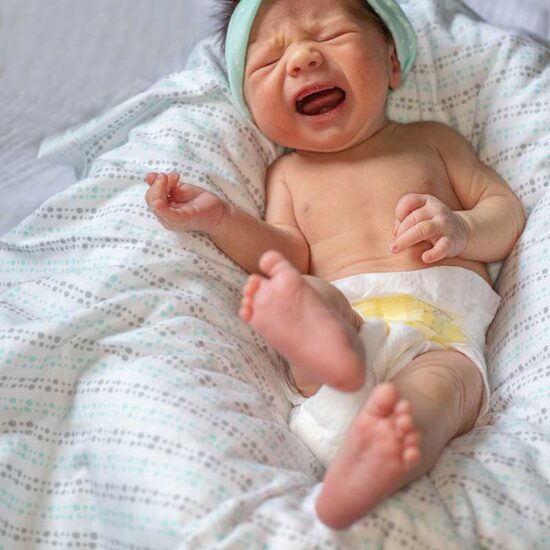 A baby with constipation may cry and look uncomfortable