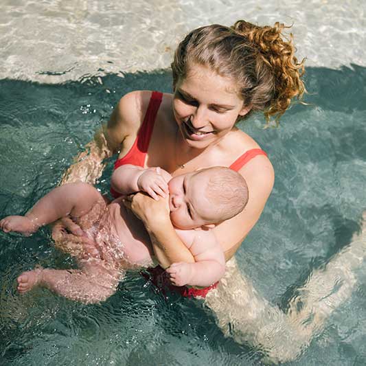 Swimming is a great postpartum exercise for mums to do with their babies
