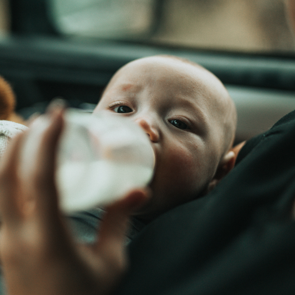 Baby having bottle of formula