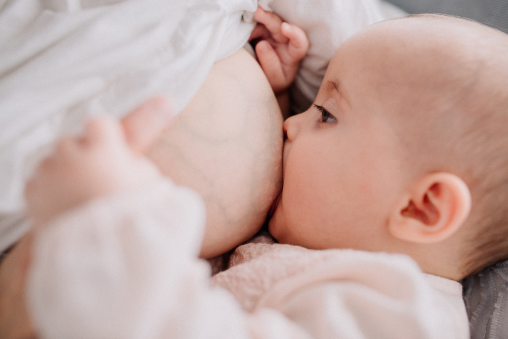 Mum breastfeeding with engorgement
