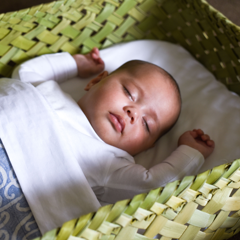 Newborn sleeping in outlet moses basket