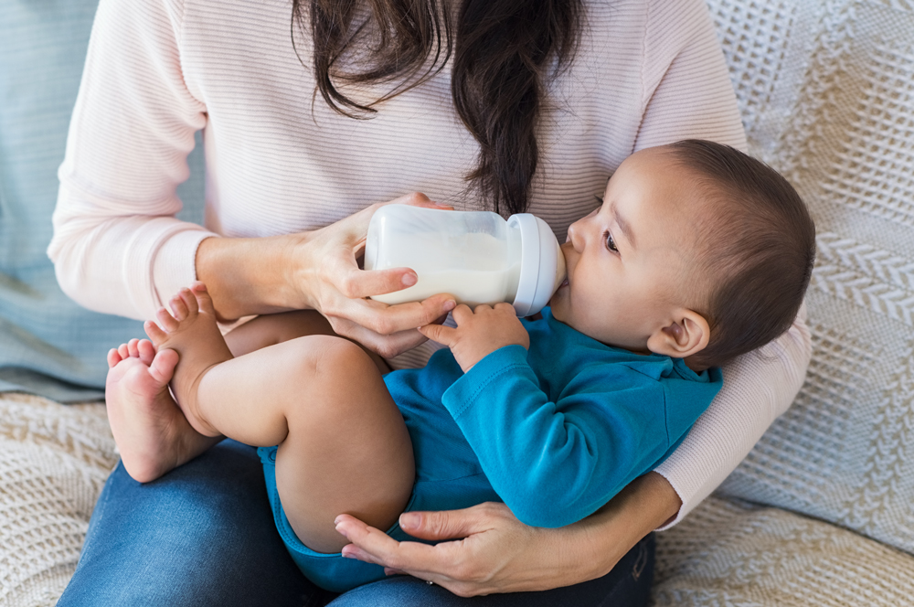 Mum practising paced bottle feeding with baby