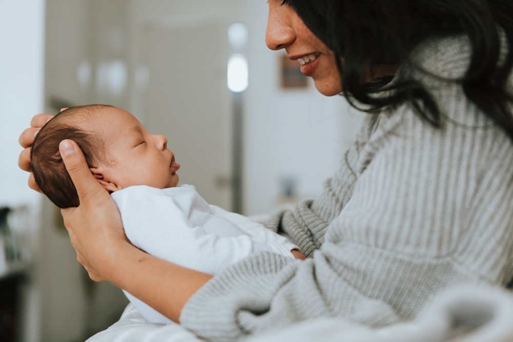 Mum bonding with newborn baby